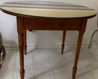 Hand crafted wood table with glass top.