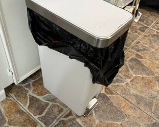 Foot-operated wastebasket