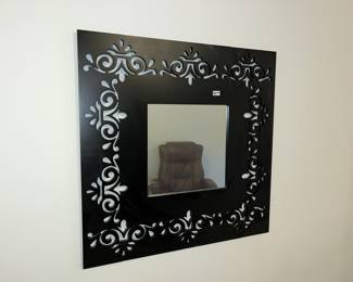 Filigree-cut mirror frame