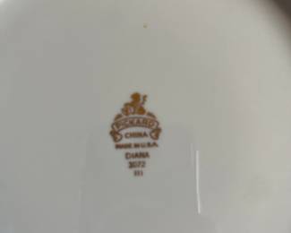 Set of Pickard porcelain dinnerware—Diana
9 dinner plates
9 rim soups
7 berry bowls
11 salad plates
6 bread plates
2 oval platters
Cream and sugar
Serving bowl
Round platter/cake plate
7 tea cups
10 saucers