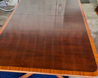 Rectangular dining table with 2 leaves, mahogany top with fruitwood marquetry border