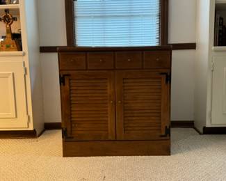 Laminate topped rock maple cabinet. 