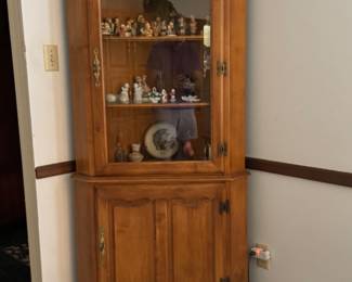 One of two curio cabinets. Lovely, rock maple. Chock full of Hummel figurines. I had an uncle who thought he was going to cash in on those things when his wife died. 