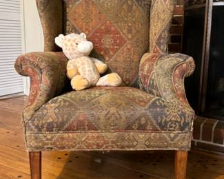 Free Teddy. He needs a home. Comfy winged-back chair.