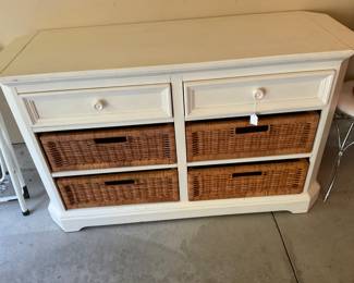 White cabinet with removable wicker basket inserts.