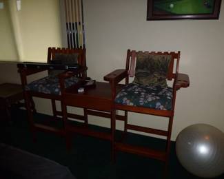 Very unique pool table chairs see the pool sticks behind the chair? The Q sticks will go with the pool table.