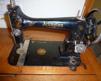 Here is that Antique pedal sewing machine that is in that beautiful wooden case. 