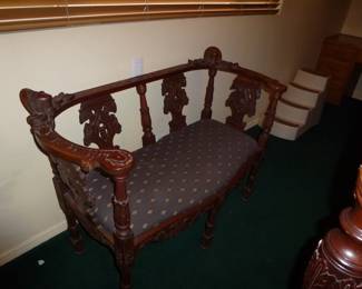what a beautiful wood carved antique bench,such fine carving,look at the womans faces (next picture!)