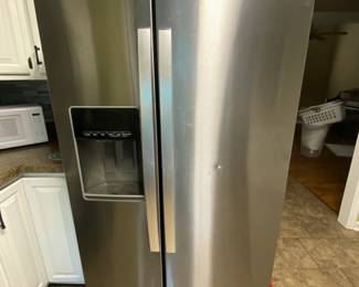 Whirpool side by side refrigerator/freezer. $300