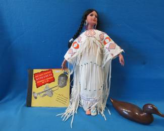 Lot 384. Ceramic duck, jazz records, and an Indian princess doll