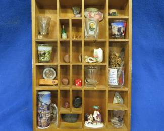 Lot 85. Shadowbox with shot glasses, rocks, and more