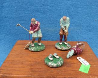Lot 236. Metal golfers