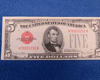 Lot 325. 1928 F U.S. Note $5.00 bill with a red seal