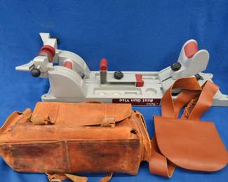 Lot 180. Tipton gun vise and two leather range bags