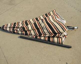 Lot 472. Crank-up patio umbrella.&nbsp; No holes.