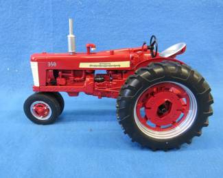 Lot 253. McCormick Farmall 350 die-cast tractor