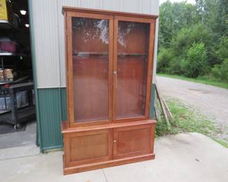 Lot 162. 10-place gun cabinet.&nbsp; 76" x 49" x 13"  Includes keys.