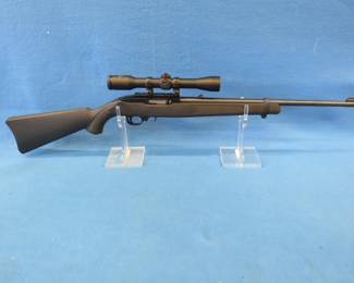 Lot 20. Ruger 10/22 semi-auto 22 rifle. Ser. no. 82751000.&nbsp; LR only.&nbsp; Synthetic stock with a Simmons 4 x 32 scope.