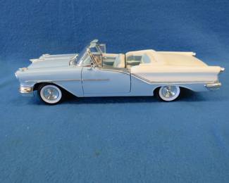 Lot 401. Road Signature 1957 Oldsmobile Super 88.&nbsp; 1:18 scale die-cast car.