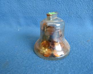 Lot 211. Just over 2 lbs. of pennies in a Liberty Bell Bank