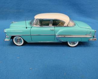 Lot 172. Franklin Mint 1954 Chevrolet Bel Air.&nbsp; 1:24 scale die-cast car.  Missing one headlight.