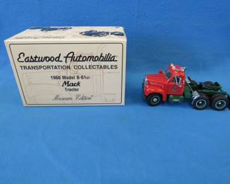 Lot 251. Eastwood Automobilia Museum Edition 1960 Model B-61 Mack Tractor.  Includes original box and COA.  Hood is damaged.