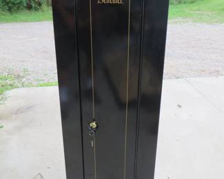 Lot 161. Sentinel metal gun cabinet with shelves.&nbsp; 53" x 17" x 13.5".&nbsp; Includes key.