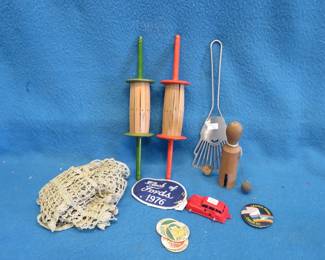 Lot 207. Noisemaker  Kite string holders Dollies and more