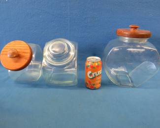 Lot 406. Three glass food storage containers with lids