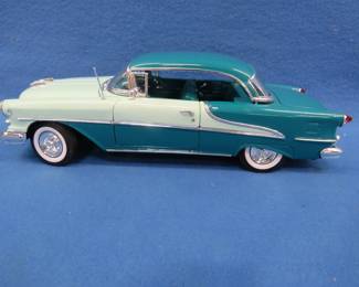 Lot 68. Welly 1955 Oldsmobile Super 88 hardtop.&nbsp; 1:18 scale die-cast car.&nbsp; Includes original box.