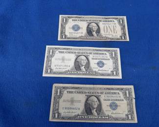 Lot 322. Three $1 Silver certificates:&nbsp; one Series 1928 B and two 1957