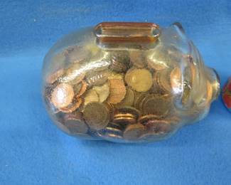 Lot 244. Glass piggybank with pennies.&nbsp; Weighs 9 pounds.