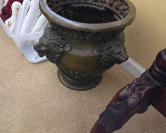 We have 2 of these large metal lion head planters...very heavy