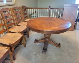 STUNNING EXCELLENT CONDITION ROUND/OVAL WITH LEAF SOLID WOOD TABLE WITH 8 PLUS 1 EXTRA....LADDER BACK CHAIRS WITH RUSH SEATING. GEARED MECHANISM FOR EASE OF INSERT AND REMOVAL OF LEAF-STUNNING DESIGN AND DETAILS...QUALITY SOLID SET WITH TABLE PROTECTOR AS WELL $400