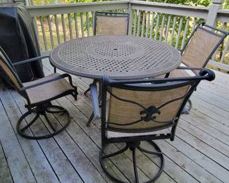 PATIO TABLE AND 4 SWIVEL CHAIRS $125....COVER AVAILABLE FOR SEPARATE PURCHASE AS WELL! GAS GRILL FOR GAS LINE FROM HOME $75