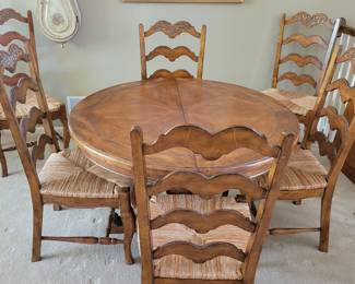 STUNNING EXCELLENT CONDITION ROUND/OVAL WITH LEAF SOLID WOOD TABLE WITH 8 PLUS 1 EXTRA....LADDER BACK CHAIRS WITH RUSH SEATING. GEARED MECHANISM FOR EASE OF INSERT AND REMOVAL OF LEAF-STUNNING DESIGN AND DETAILS...QUALITY SOLID SET WITH TABLE PROTECTOR AS WELL $400