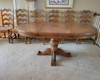 STUNNING EXCELLENT CONDITION ROUND/OVAL WITH LEAF SOLID WOOD TABLE WITH 8 PLUS 1 EXTRA....LADDER BACK CHAIRS WITH RUSH SEATING. GEARED MECHANISM FOR EASE OF INSERT AND REMOVAL OF LEAF-STUNNING DESIGN AND DETAILS...QUALITY SOLID SET WITH TABLE PROTECTOR AS WELL $400