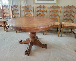 STUNNING EXCELLENT CONDITION ROUND/OVAL WITH LEAF SOLID WOOD TABLE WITH 8 PLUS 1 EXTRA....LADDER BACK CHAIRS WITH RUSH SEATING. GEARED MECHANISM FOR EASE OF INSERT AND REMOVAL OF LEAF-STUNNING DESIGN AND DETAILS...QUALITY SOLID SET WITH TABLE PROTECTOR AS WELL $400