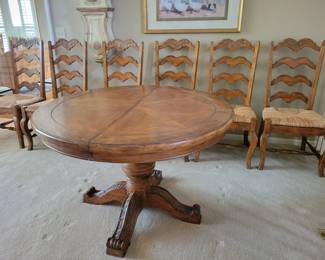 STUNNING EXCELLENT CONDITION ROUND/OVAL WITH LEAF SOLID WOOD TABLE WITH 8 PLUS 1 EXTRA....LADDER BACK CHAIRS WITH RUSH SEATING. GEARED MECHANISM FOR EASE OF INSERT AND REMOVAL OF LEAF-STUNNING DESIGN AND DETAILS...QUALITY SOLID SET WITH TABLE PROTECTOR AS WELL $400