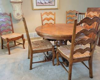 STUNNING EXCELLENT CONDITION ROUND/OVAL WITH LEAF SOLID WOOD TABLE WITH 8 PLUS 1 EXTRA....LADDER BACK CHAIRS WITH RUSH SEATING. GEARED MECHANISM FOR EASE OF INSERT AND REMOVAL OF LEAF-STUNNING DESIGN AND DETAILS...QUALITY SOLID SET WITH TABLE PROTECTOR AS WELL $400