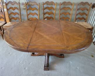 STUNNING EXCELLENT CONDITION ROUND/OVAL WITH LEAF SOLID WOOD TABLE WITH 8 PLUS 1 EXTRA....LADDER BACK CHAIRS WITH RUSH SEATING. GEARED MECHANISM FOR EASE OF INSERT AND REMOVAL OF LEAF-STUNNING DESIGN AND DETAILS...QUALITY SOLID SET WITH TABLE PROTECTOR AS WELL $400