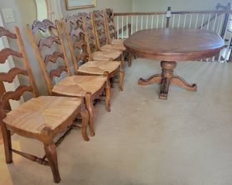 STUNNING EXCELLENT CONDITION ROUND/OVAL WITH LEAF SOLID WOOD TABLE WITH 8 PLUS 1 EXTRA....LADDER BACK CHAIRS WITH RUSH SEATING. GEARED MECHANISM FOR EASE OF INSERT AND REMOVAL OF LEAF-STUNNING DESIGN AND DETAILS...QUALITY SOLID SET WITH TABLE PROTECTOR AS WELL $400