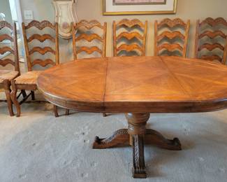 STUNNING EXCELLENT CONDITION ROUND/OVAL WITH LEAF SOLID WOOD TABLE WITH 8 PLUS 1 EXTRA....LADDER BACK CHAIRS WITH RUSH SEATING. GEARED MECHANISM FOR EASE OF INSERT AND REMOVAL OF LEAF-STUNNING DESIGN AND DETAILS...QUALITY SOLID SET WITH TABLE PROTECTOR AS WELL $400