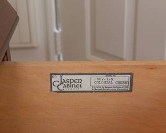 Jasper Cabinet Company Colonial Cherry secretary with a slant top, a four-drawer block front, crown (“wavy”) glass doors, and solid brass hardware. One-piece.
Features built-in light, multiple storage compartments, and antique black leather inlay writing surface.
Adjustable glass shelves include plate rail.
Measures 35”W × 18”D× 84ʺH, moulding detail at top and bottom adds approx. 1” to width and depth.