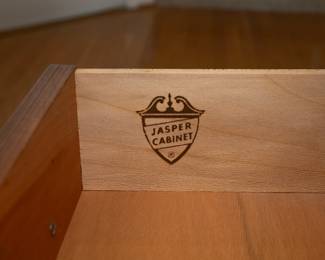 Jasper Cabinet Company Colonial Cherry secretary with a slant top, a four-drawer block front, crown (“wavy”) glass doors, and solid brass hardware. One-piece.
Features built-in light, multiple storage compartments, and antique black leather inlay writing surface.
Adjustable glass shelves include plate rail.
Measures 35”W × 18”D× 84ʺH, moulding detail at top and bottom adds approx. 1” to width and depth.