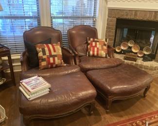 Matching leather chairs and ottomans