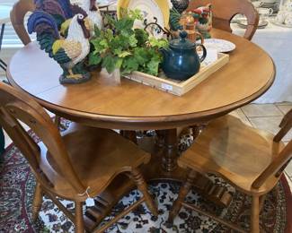 Breakfast table has extra leaves and 6 chairs