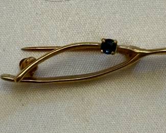 Gold wishbone brooch