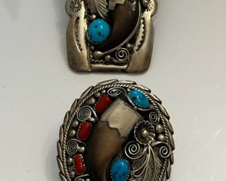 Two bolo medallions. Top marked "A" and bottom designed by Lewis Lomay (LL)