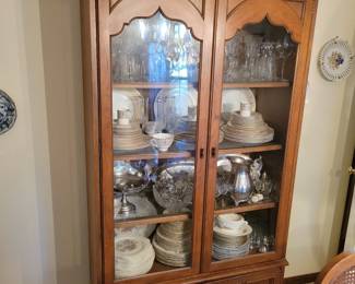 CHINA CABINET FILLED WITH SETS OF DINNERWARE